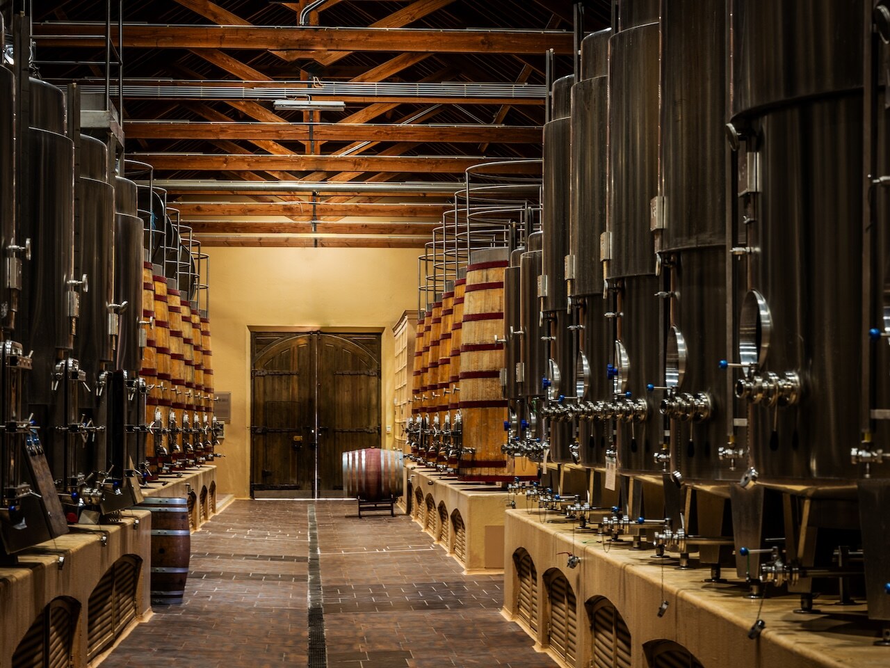 The fermentation hall at ODE Winery — tanks, timber and terracotta.