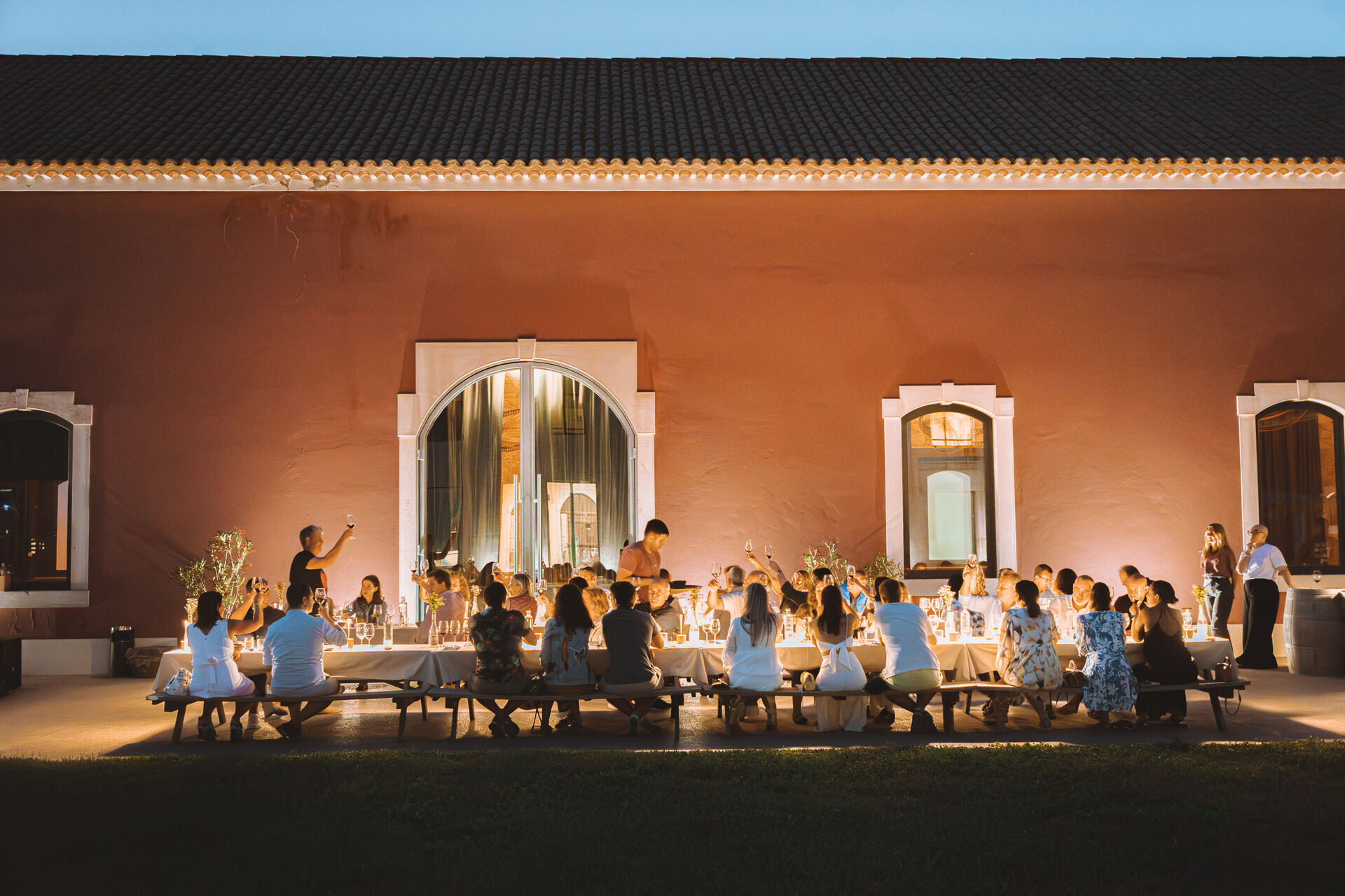 A long-table dinner at dusk outside Ode Winery.