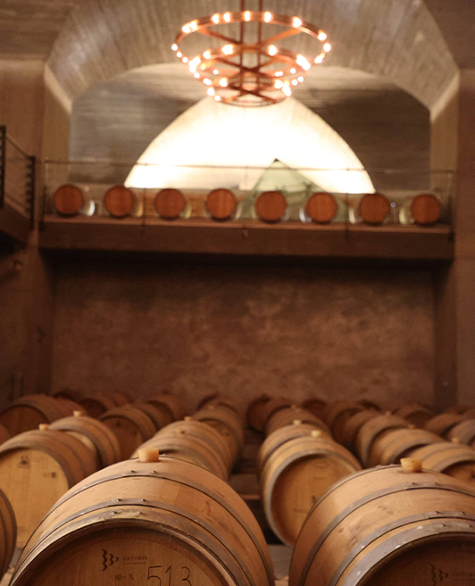 The vaulted brick cellar with copper chandeliers at ODE Winery.