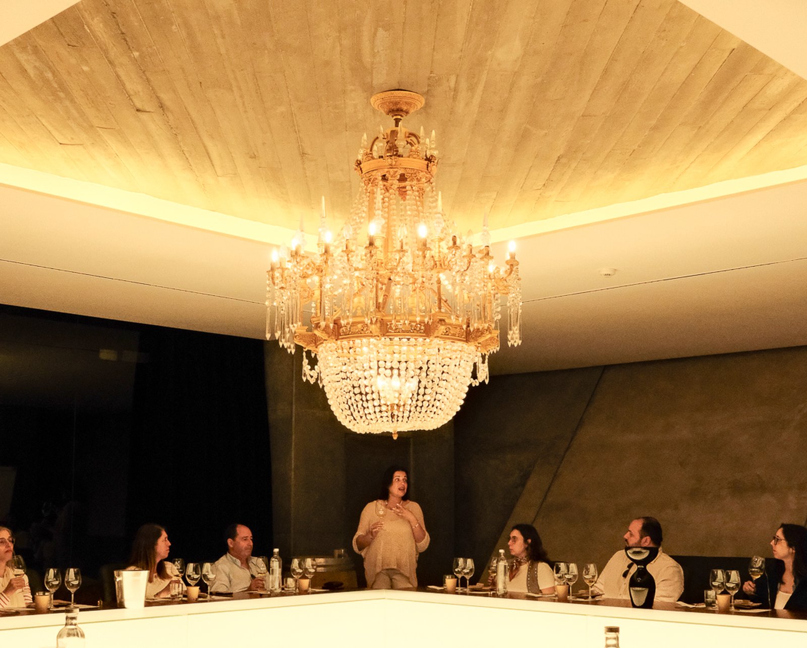 The copper chandelier cellar seen through the oak foudres.